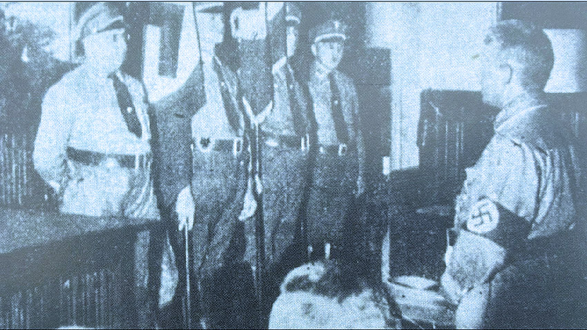 Im Friedenssaal bringt Arnoldi (rechts) seine NS-Untergebenen auf Kurs. Ausschnitt: Osnabrücker Zeitung vom 04.07.1935, vgl. Band Heese/Topografien, S. 87